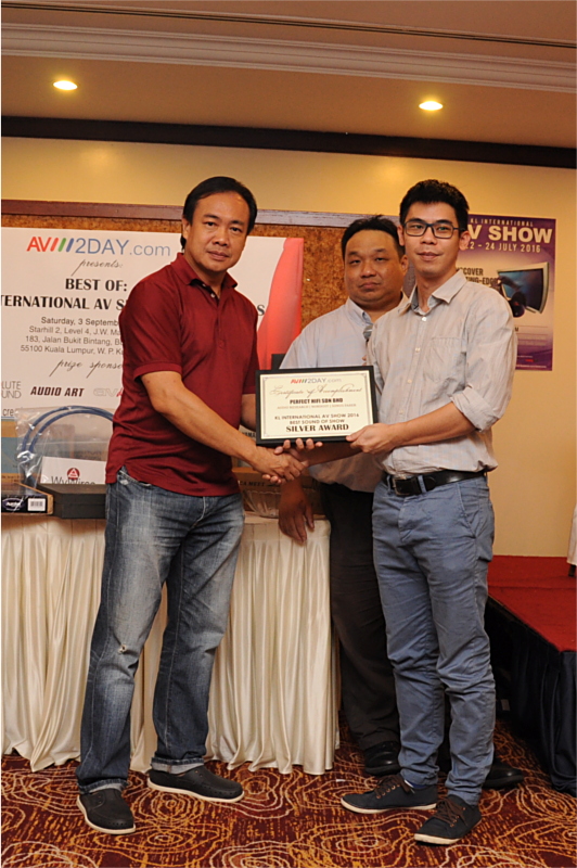 A representative from Perfect Hi-Fi receiving the award.