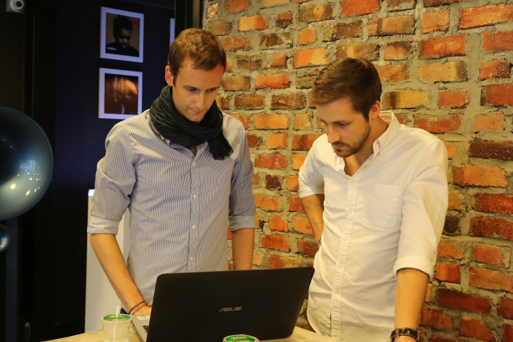 Maxime Dumont (left) and Ghislain Moret examining the data on the laptop.