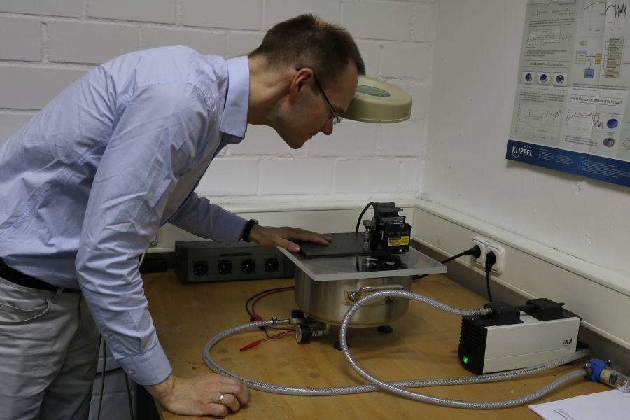 The headphone driver is placed in a vacuum chamber for the measurements to be recorded.