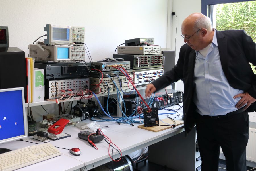 Shandro showing the equipment for testing and measurements.