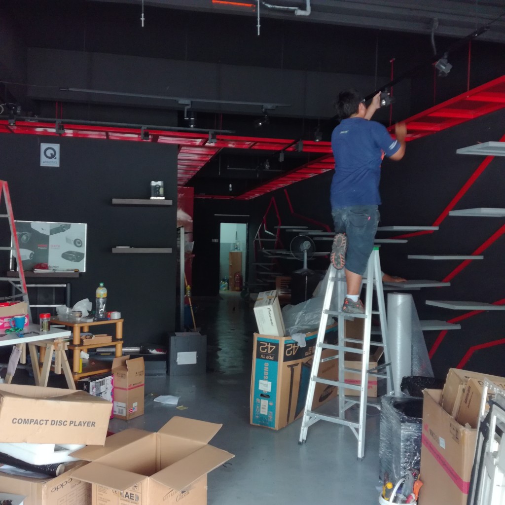 A worker removing the fittings from the showroom.