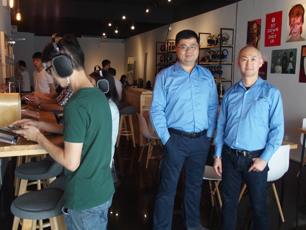 Acoustic Research's Merry men in blue. On the left Ares Li, Technical Director and at the right, Eric Suh, Director of Sales and Marketing