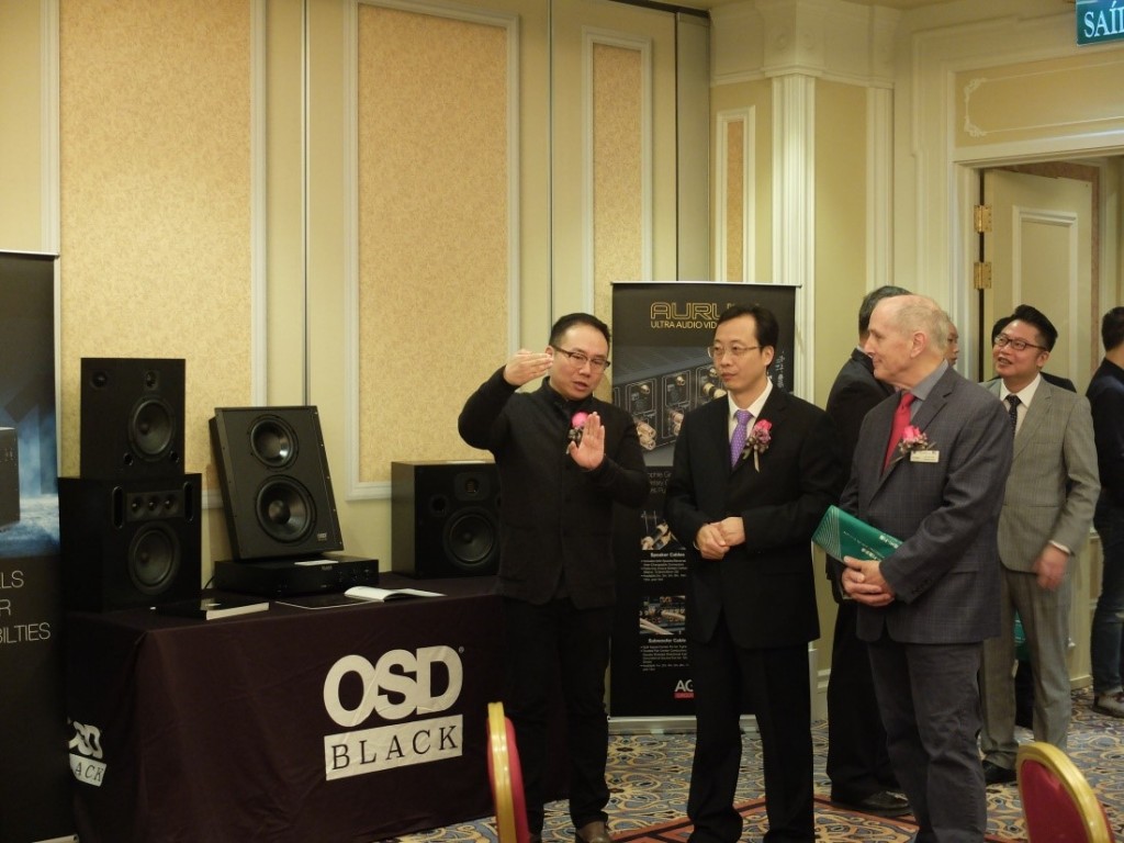 Marcus Yang (1st on the left) explaining to dignitaries about the custom install speakers on display by one of the exhibitors