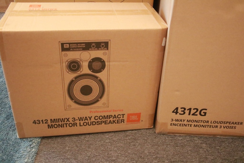Thhe JBL speakers are still in their boxes.
