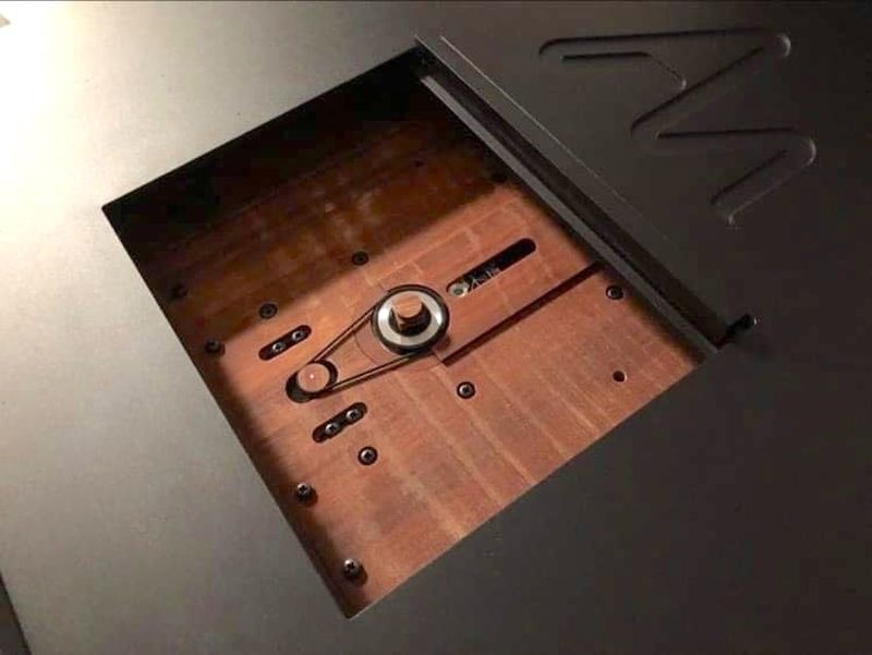 The Audio Note belt-drive CD transport uses Permali wood.